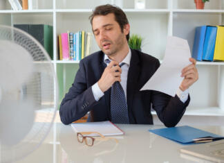 Office employee feeling stressed after summer heat haze