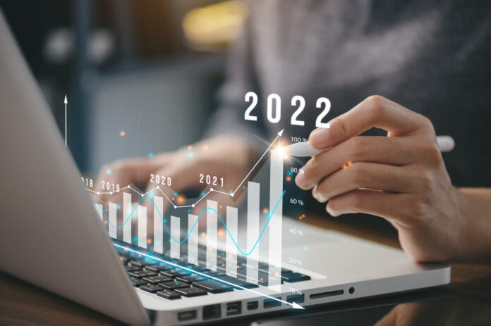 Businessman plan business growth and financial, increase of positive indicators in the year 2022 to increase business growth and an increase for growing up business 