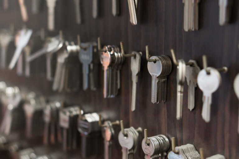Several Keys type such as household and car key use for copying or duplicating hang on the wall in the locksmith workshop