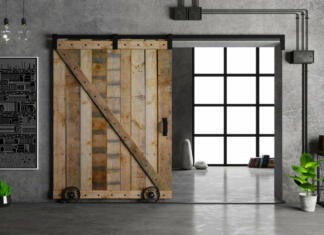 Drsna ali krilna notranja vrata? 3d illustration. Modern interior in loft style barn sliding wooden door in loft room. Studio