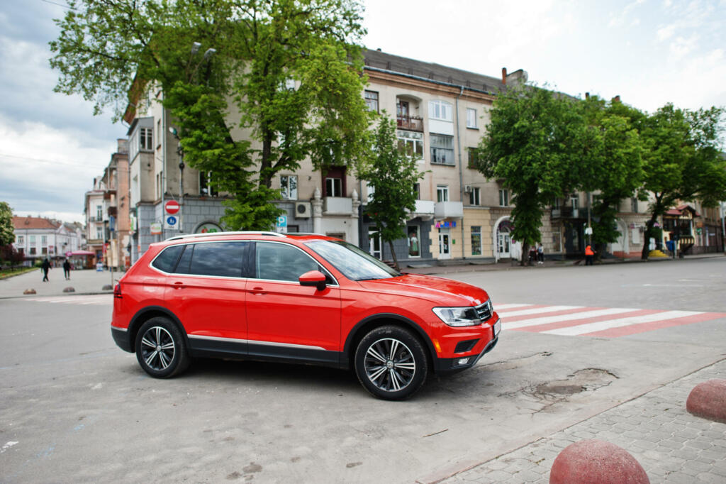 Kyiv, Ukraine - May 14, 2021: New orange Volkswagen Tiguan at street.