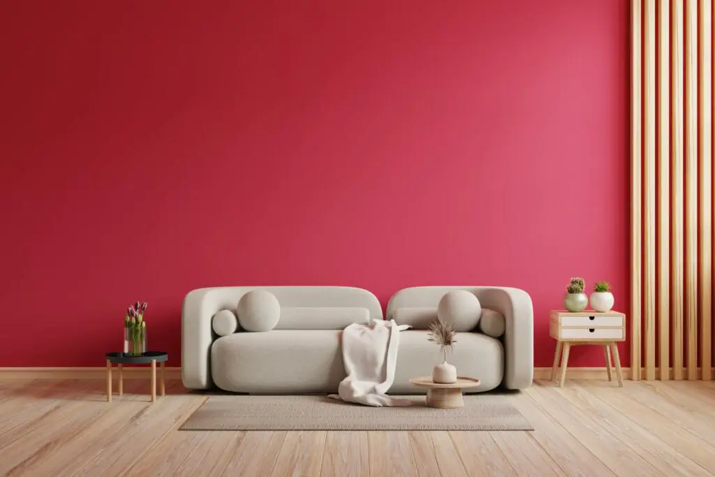 Viva magenta wall background mockup with sofa furniture and decor.3d rendering