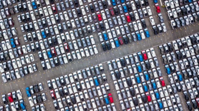 Aerial view new cars parking for sale stock lot row, New cars dealer inventory import export business commercial global, Automobile and automotive industry distribution logistic transport worldwide.
