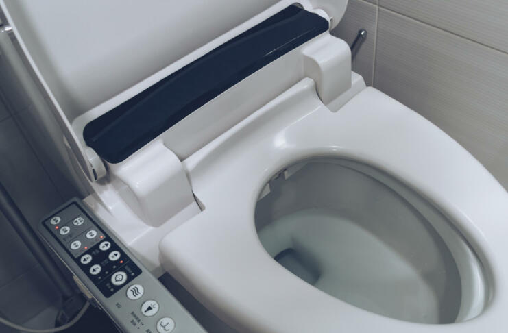 close up view of smart toilet seating with washing, cleaning, drying functions and ability to use it for child and women
