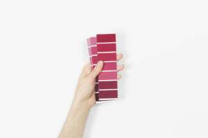 Color swatches with color of the year 2023 - Viva Magenta. Color trend palette. Top view, flat lay.