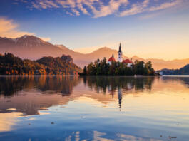 Lake Bled, Slovenia. Sunrise at Lake Bled with famous Bled Island and historic Bled Castle in the background.