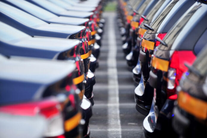 Outdoor detail shot with lot of brand new cars in a row