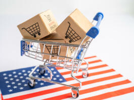 Box with shopping cart logo and USA America flag, Import Export Shopping online or eCommerce finance delivery service store product shipping, trade, supplier concept.