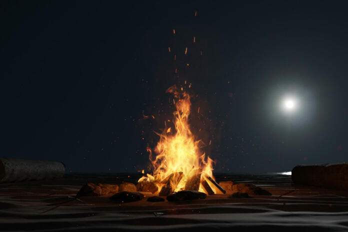 3d rendering of large bonfire with sparks and particles in front of full moon light at sand beach