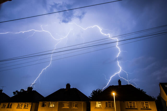 Lightning Storm in the Night Sky Above Residential Houses in Essex, UK.