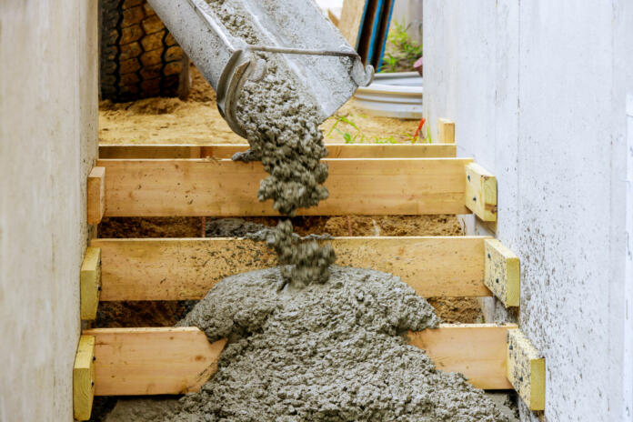 Pouring staircase in residential house building concreting steps with formwork