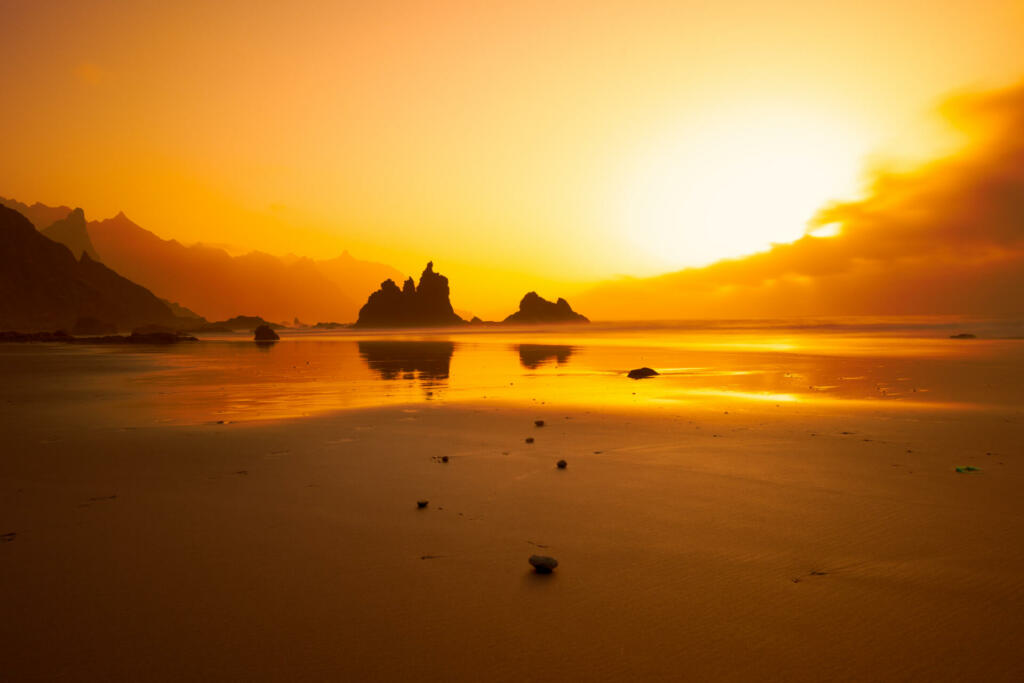 Sunset at Benijo beach with mountains in the background, sea and mountains in Benijo, Tenerife Island.