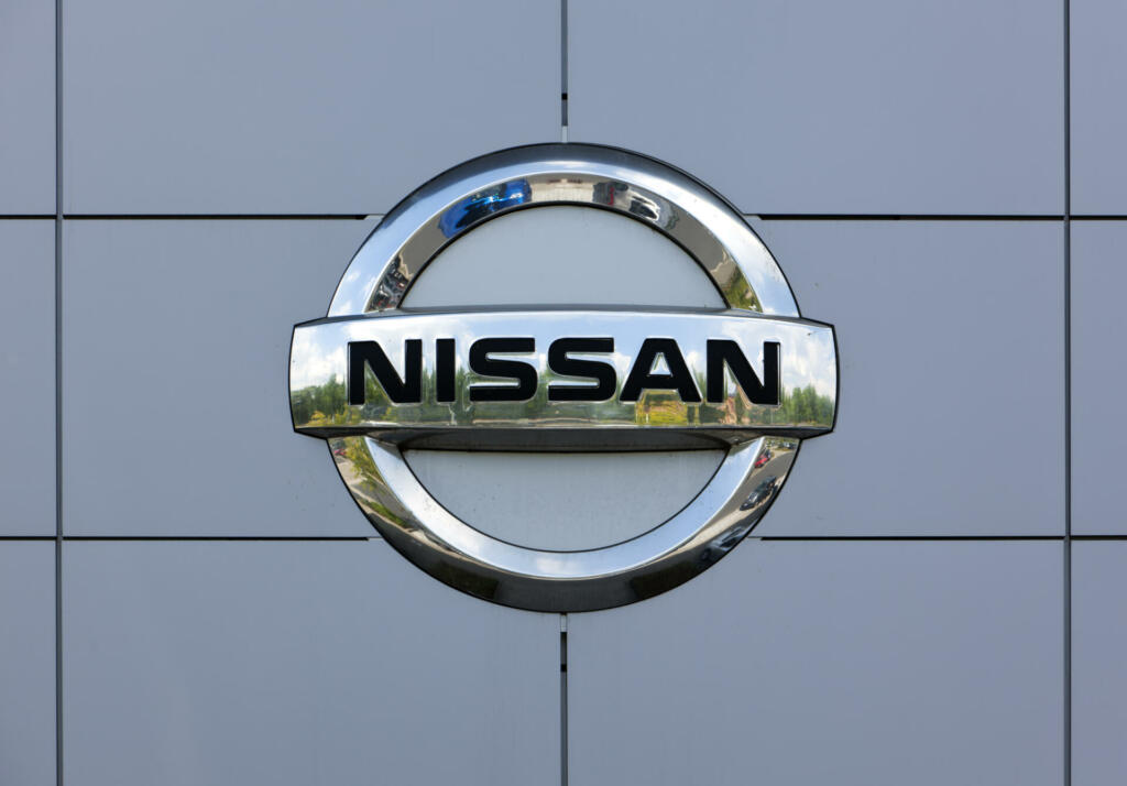 Dusseldorf, Germany - June 12, 2011: Nissan logo at the wall of car dealer's building. Nissan Motor Company Ltd is a mulrinational car manufacturer headquartered in Yokohama, Japan.