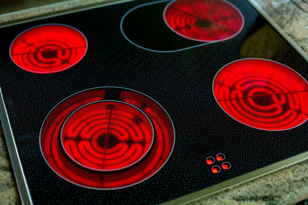 close-up of round red glowing induction stove