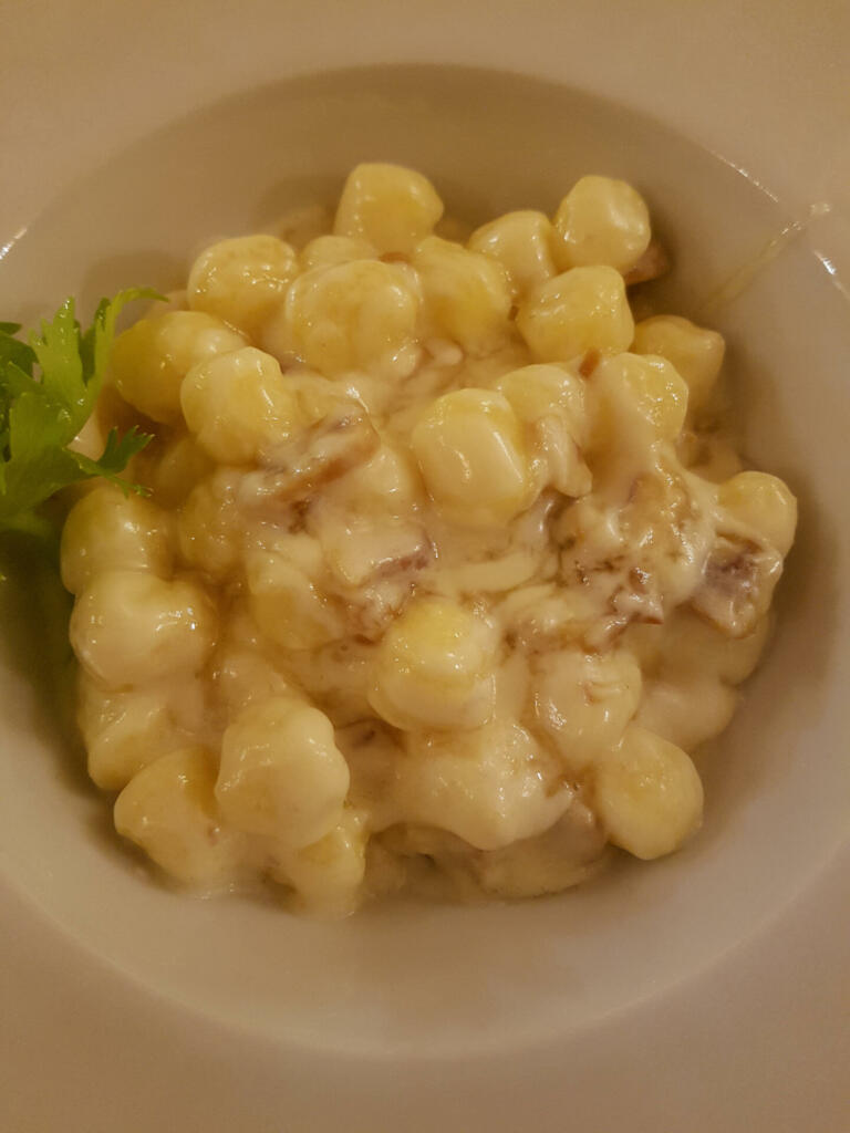 Close up on gnocchi woth gorgonzola and chestnuts.