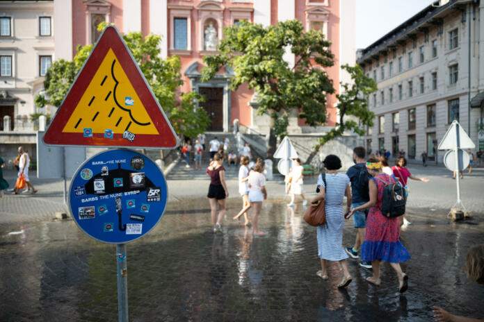 Ljubljana, Slovenia - August 13, 2021: In the city center Preseren square in Ljubljana a refreshing instantiation for pedestrian took place for most warm months of the year. A water shower that simulates rain for some square meters in the center of the square