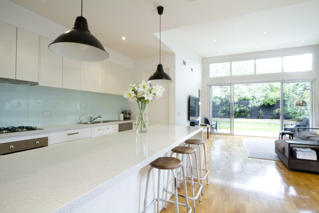 Contemporary kitchen and open plan living room with garden aspect