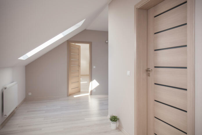 Interior of beige room at the attic