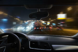 view from moving car on highway at night