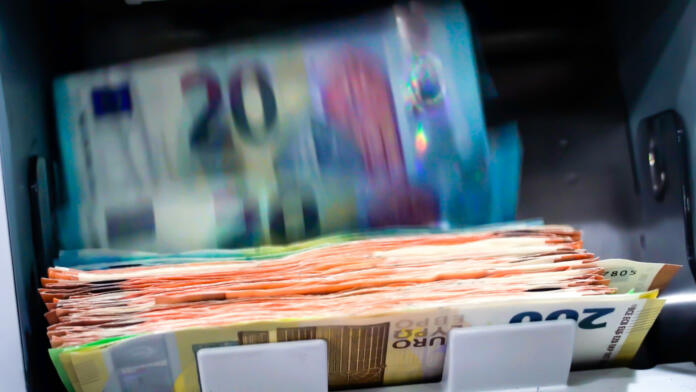 The Euro Currency Banknotes In A Currency Counting Machine.
