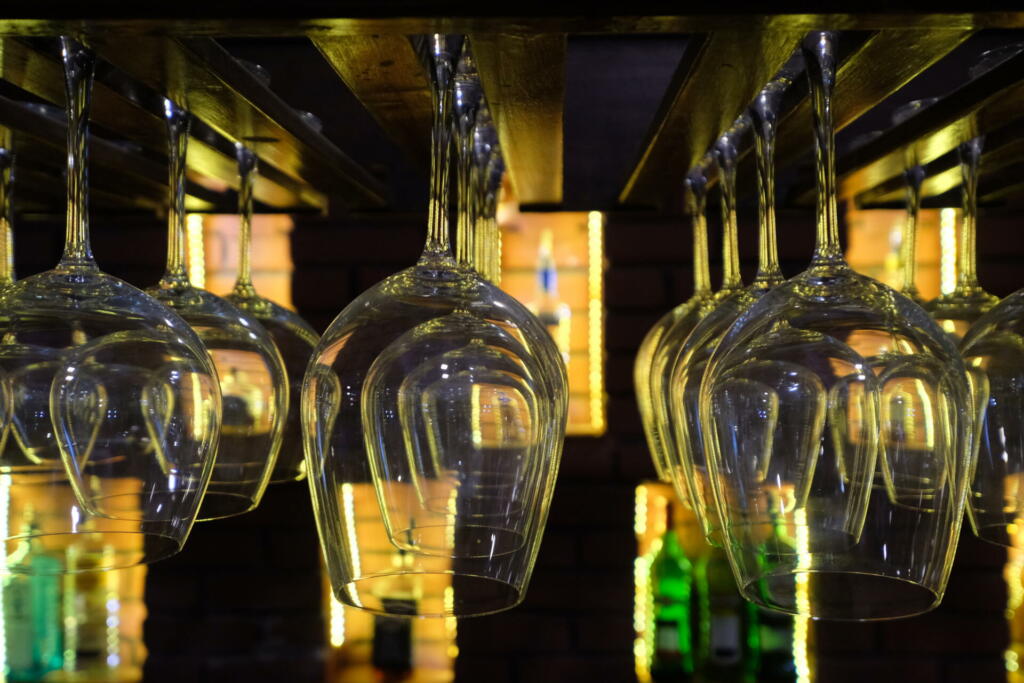 Blurred bottles of wine on cabinet as background