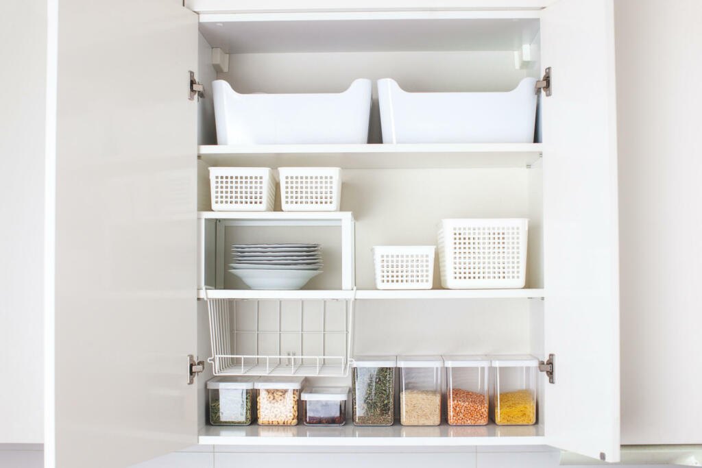 House decor ideas. Storage in the kitchen. Home organization. White shelf and modern interior.