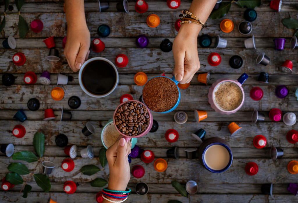 Many types of coffee on the wooden table.