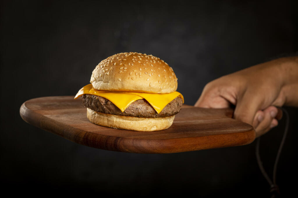 Delicious hamburger on dark background