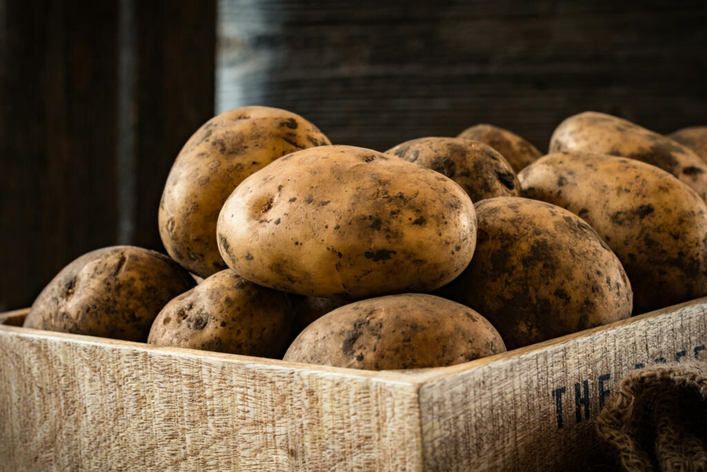 Heirloom potatoes in a wooden box, close up