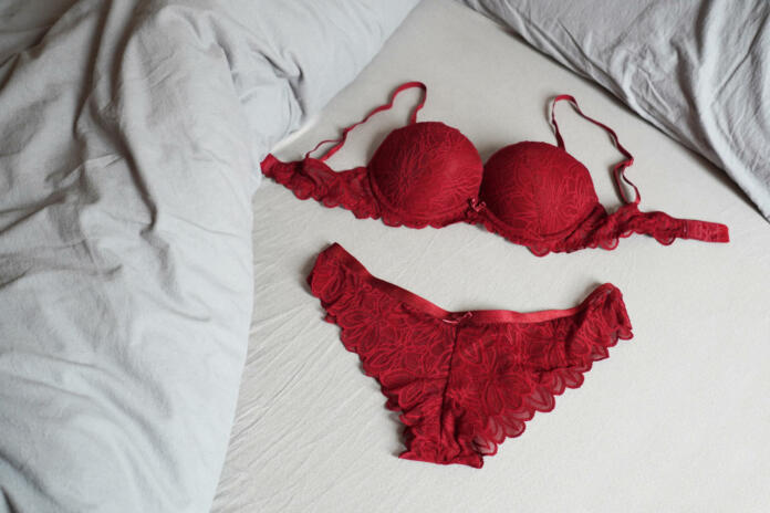 red bar and panties lingerie set on bed