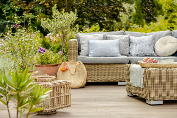 Modern designed terrace with wicker furniture and plants