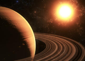 Se na Saturnovi luni skriva življenje? The sun shines on Saturn in space high quality 3d illustration.