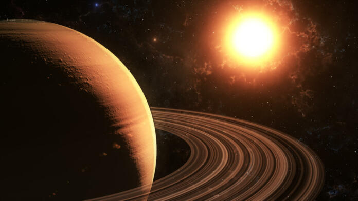 The sun shines on Saturn in space high quality 3d illustration.