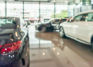 new cars in showroom interior blurred abstract background