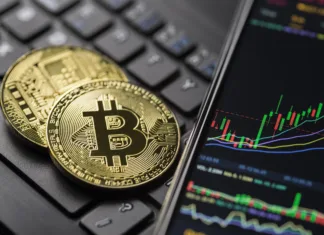 Po Trumpovi zmagi je Bitcoin spet dosegel najvišjo vrednost v zgodovini, rastejo tudi druge kriptovalute Ljubljana, Slovenia - may 12 Bitcoin gold cryptocurrency trading chart on smartphone close up.