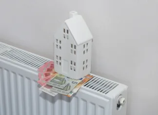 Kako privarčevati pri nakupu in vzdrževanju toplotnih črpalk? Home heating expenses and savings concept. Figure of house and money on heating radiator.