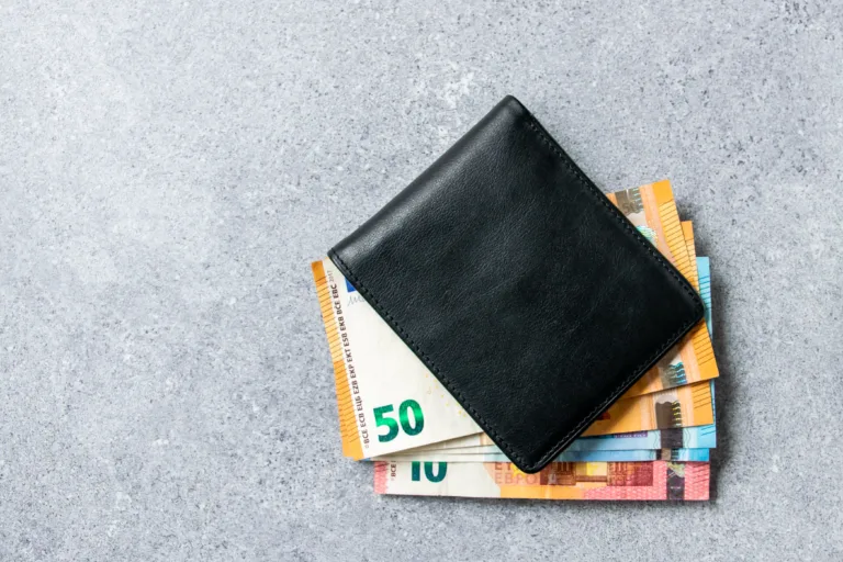 Leader black partmone with euro money. Bills in the wallet for commerce concept. Space for text.