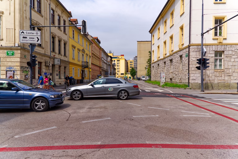 Traffic at crossroads of Resljeva Road at Slovenian City of Ljubljana on a cloudy summer day. Photo taken August 9th, 2023, Ljubljana, Slovenia.