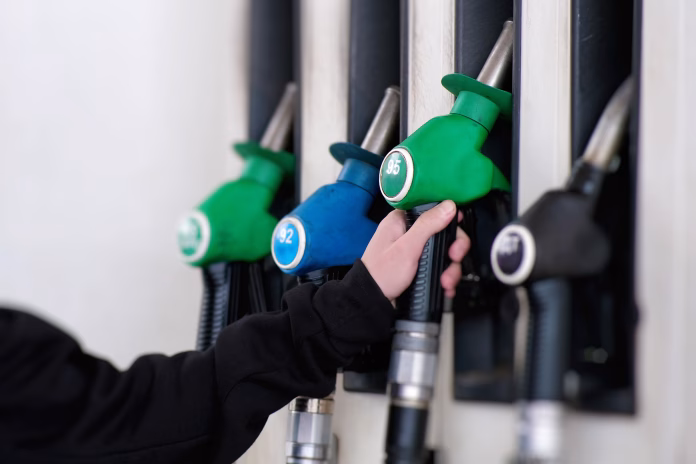 a-closeup-view-of-vibrant-fuel-pumps-at-a-bustling-service-station-fully-prepared-for-vehicle-refueling-at-any-moment-stockpack-istock A closeup view of vibrant fuel pumps at a bustling service station, fully prepared for vehicle refueling at any moment