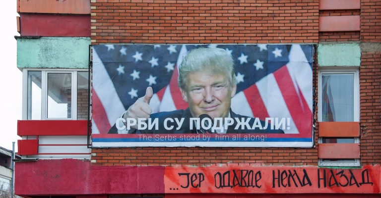 MITROVICA, KOSOVO- MARCH 13, 2017: year. President Donald Trump on the billboard in the northern part of  Kosovska Mitrovica in which live Serbs