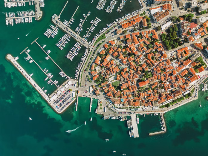 biograd-na-moru-aerial-above-marina-view-with-ships-and-yachts-at-pier-in-row-old-european-architecture-in-summer-port-travel-destination-on-adriatic-sea-coast-dalmatia-region-of-croatia-stockpack-istock Biograd na Moru, aerial above marina view with ships and yachts at pier in row. Old European architecture in summer port, travel destination on Adriatic Sea coast, Dalmatia region of Croatia