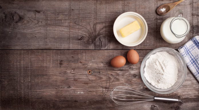 rough-background-with-the-ingredients-for-a-cake-milk-eggs-butter-salt-sugar-and-flour-stockpack-istock rough background with the ingredients for a cake (milk , eggs , butter, salt, sugar and flour)