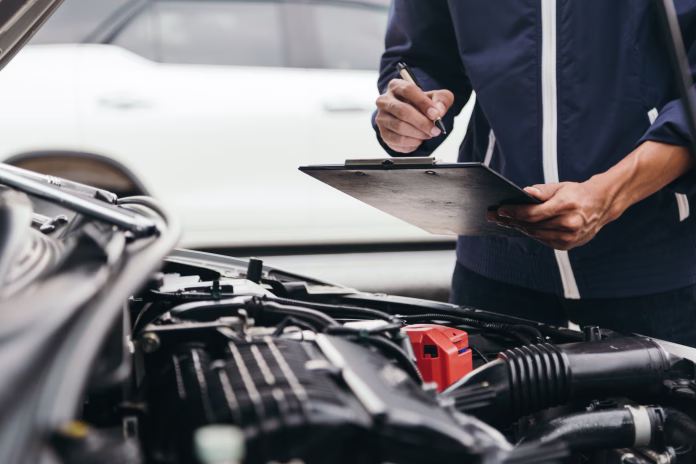 automobile-mechanic-repairman-hands-repairing-a-car-engine-automotive-workshop-with-a-wrench-car-service-and-maintenancerepair-service-stockpack-istock Automobile mechanic repairman hands repairing a car engine automotive workshop with a wrench, car service and maintenance,Repair service.