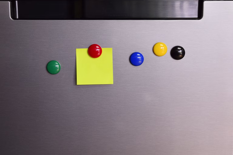 Close-Up Of Multi Colored Ball On Refrigerator