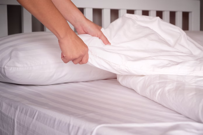 the-hands-of-housewives-who-are-changing-sheets-in-hotels-stockpack-istock The hands of housewives who are changing sheets in hotels.