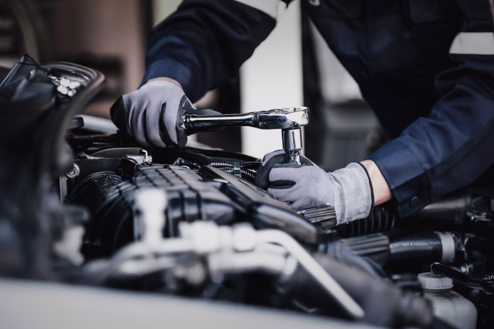 professional-mechanic-working-on-the-engine-of-the-car-in-the-garage-car-repair-service-the-concept-of-checking-the-readiness-of-the-car-before-leaving-stockpack-istock Professional mechanic working on the engine of the car in the garage. Car repair service. The concept of checking the readiness of the car before leaving.