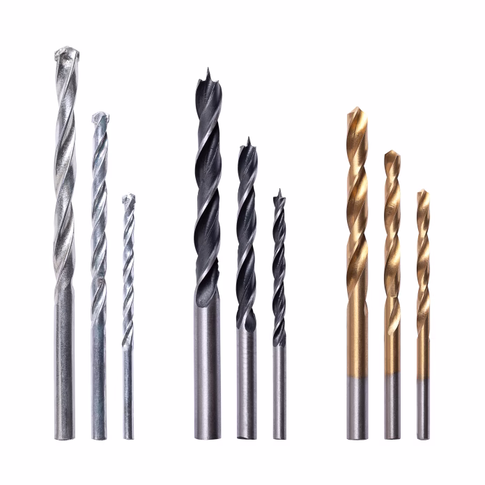 drill-bit-set-three-sizes-for-drilling-wall-wood-and-metal-masonry-drill-bits-with-blunt-end-on-the-left-side-brad-point-drills-for-wood-in-the-center-and-right-coated-twist-drill-bits-for-metal-stockpack-istock Drill bit set, three sizes for drilling wall, wood and metal. Masonry drill bits with blunt end on the left side, brad point drills for wood in the center, and right coated twist drill bits for metal.