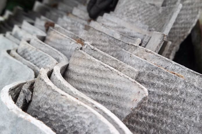stack-of-asbestos-roofing-sheets-carcinogenic-eternite-stockpack-istock Stack of asbestos roofing sheets. Carcinogenic eternite.