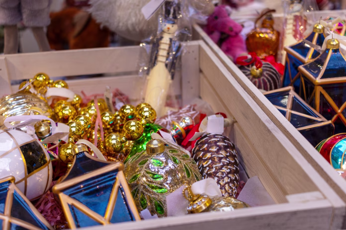 Christmas tree toys in wooden box atstore. New Year's sale.