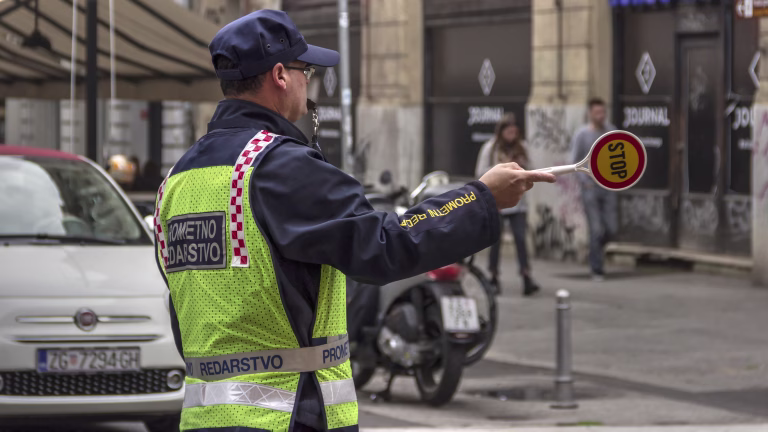 Zagreb, Croatia, November 05th 2018: Traffic Police Officer regulates the traffic in Ilica Street at morning rush hour.